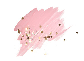 Golden glitter and glittering stars on abstract pink watercolor splash on white background