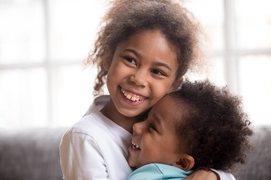 Funny black siblings hug making peace after fight