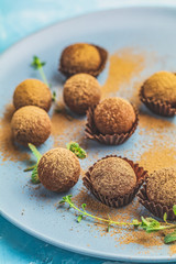Cocoa balls, handmade chocolate balls cakes in a blue tray
