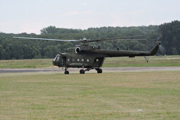 A military helicopter takes off at the airport © E-lona
