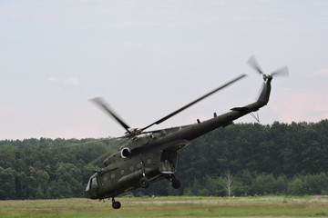 A military helicopter takes off at the airport © E-lona
