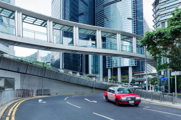 Street scene of the downtown at day in China. Hong Kong city Central street at Western District. Blurred taxi car move on road. City structure. - 253031571