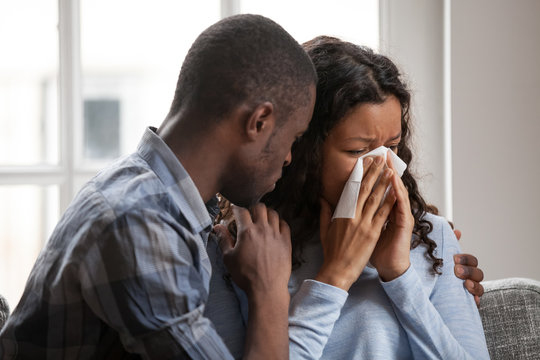 Caring Black Husband Hug Supporting Sad Crying Wife