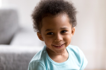 Portrait of cute mixed race toddler boy smiling