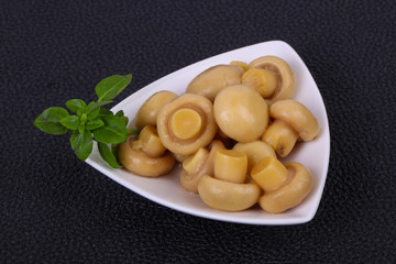 Pickled champignon heap in the bowl