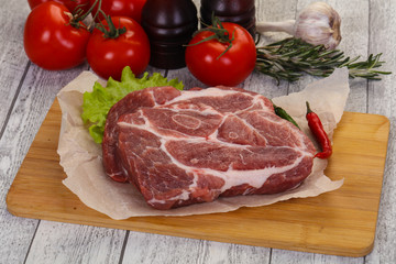 Raw pork neck steak