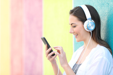 Profile of a girl choosing songs listening to music