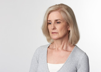 sad 50s years old woman isolated
