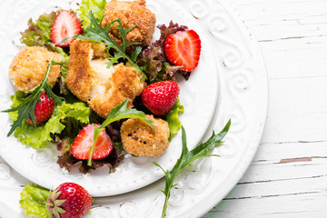Salad with meat and strawberries