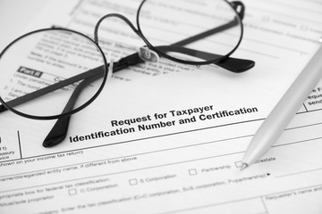 Individual income tax return form and glasses