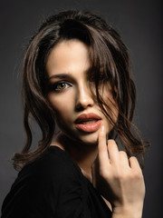 Beautiful woman with brown hair. Attractive model with brown eyes.