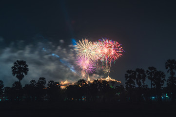 Annual festival of Khao Wang temple with colorful fireworks on hill at night