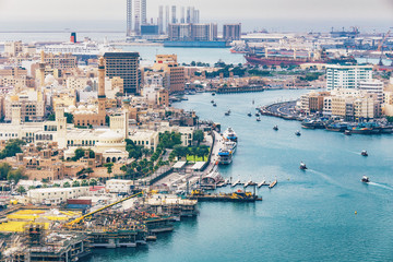 Fototapeta premium Aerial daytime skyline of Dubai, UAE. View on harbor in the distance. Scenic travel background.