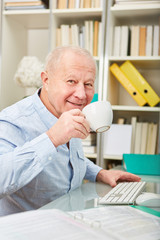 Fototapeta premium Senior businessman in a coffee break