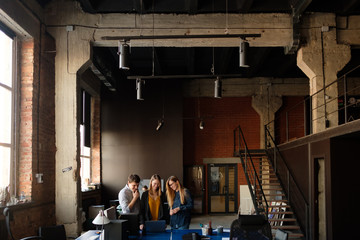 The team is working on a project in a modern office.