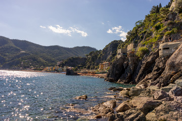Fototapeta na wymiar Italy, Cinque Terre, Monterosso, a rocky island in the middle of a body of water