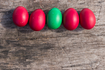 Fototapeta na wymiar Painted Easter eggs on rustic wooden background