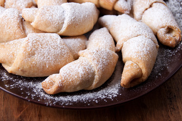 Homemade bagels with jam and powdered sugar
