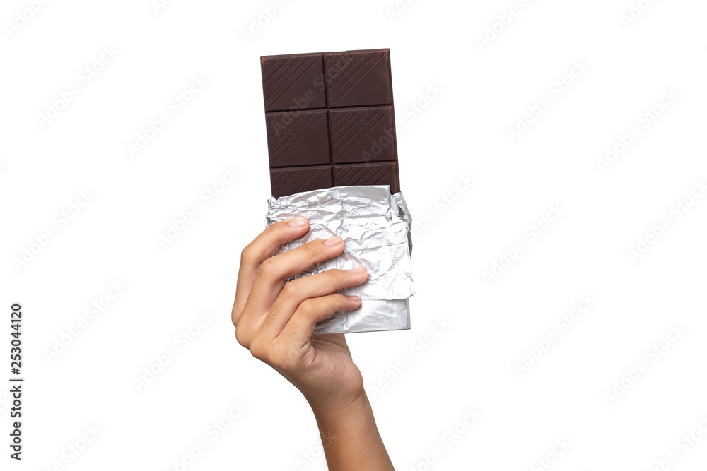 Wall mural close-up hand holding chocolate isolated on a white background