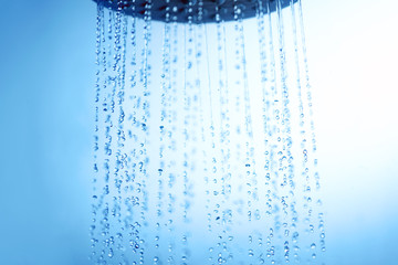 Naklejka na ściany i meble Showerhead and water drops.