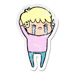 distressed sticker of a cartoon boy crying