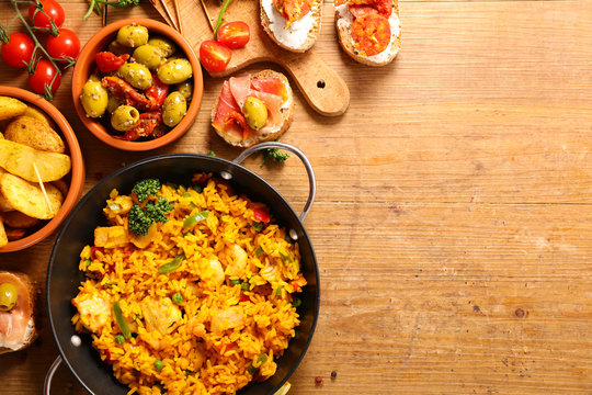 differents sort of spanish food. paella, tapas, potato,mussel