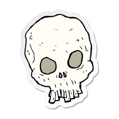 sticker of a cartoon spooky skull