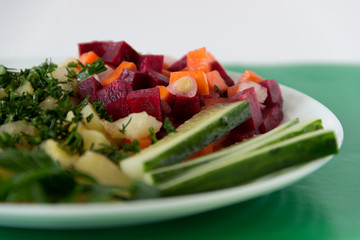 Stewed potatoes with vegetable garnish.
