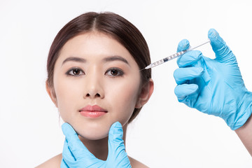 Surgery concept. The doctor cosmetologist makes the Rejuvenating facial injections procedure for...