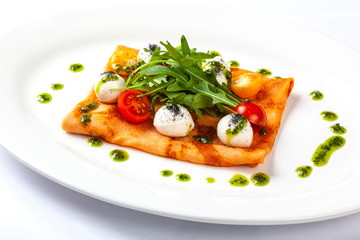 Pancake with tomato and Arugula