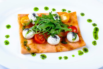Pancake with tomato and Arugula