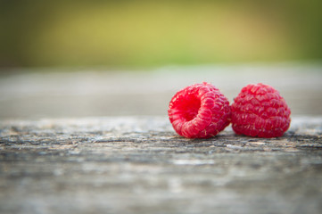 ripe raspberries on a natural background outdoors
