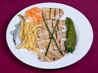 Grilled pork loin fillets with garnish