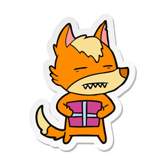 distressed sticker of a cartoon fox with present