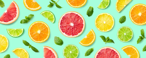  Colorful pattern of citrus fruit slices and mint leaves © baibaz