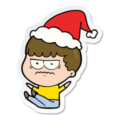 sticker cartoon of a annoyed man wearing santa hat