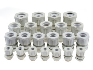 A group of plastic cable glands isolated on white background