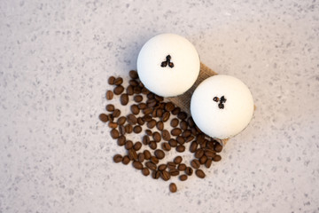 Bath bombs with coffee grains on a white background