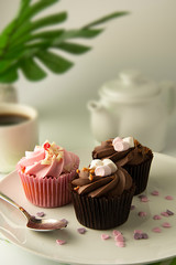 Delicious Mothers day chocolate cupcakes. Sweet dessert. Birthday, party food. Bright background. Food photo.