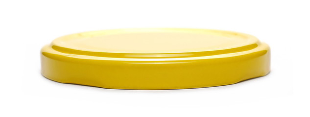 Yellow jar lid isolated on white background