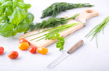 Vegetables and spices on a chopping board.