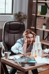 Blonde-haired woman feeling at a loss after problems at work