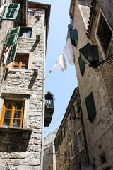 Street in the old town of Kotor, Montenegro, with its old stone houses and very narrow streets 