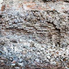 Old abandoned wall with bricked up windows