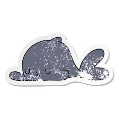 distressed sticker of a quirky hand drawn cartoon whale