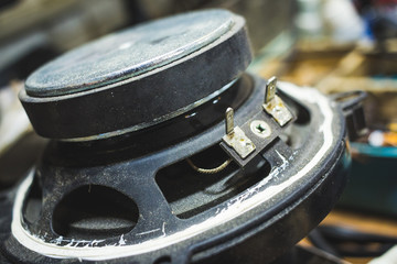 Shot of old dusty speaker as a technical design or a background
