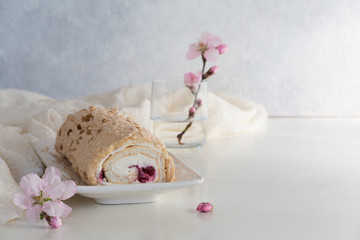 Spring meringue cake roll with cream cheese and berry filling