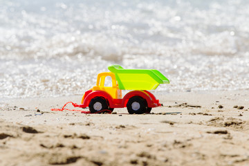 Fototapeta na wymiar Toy truck on the beach