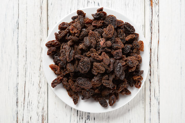top view raisin on white wood background