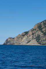 Fototapeta na wymiar Italy, Cinque Terre, Monterosso, Monterosso al Mare, SCENIC VIEW OF SEA AND MOUNTAIN AGAINST CLEAR BLUE SKY